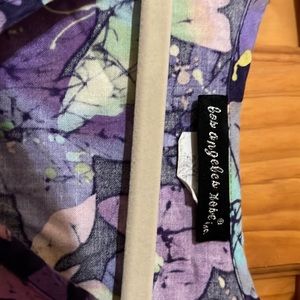 Los Angeles Rose scrub top faux wrap style. 2 front pocket with back tie